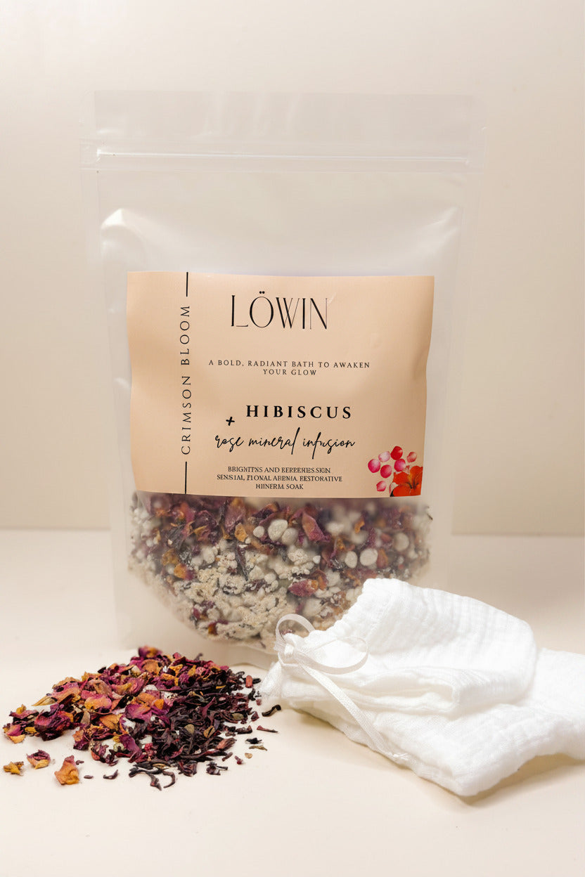 Bag of hibiscus and rose bath tea with a white towel on a light background, featuring the brand 'Löwin'.