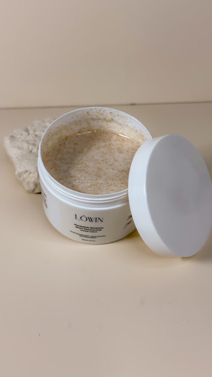 Open jar of Löwin Body Polish product with a white lid on a beige surface
