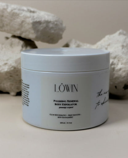 Jar of Löwin Polishing Renewal Body Exfoliator with decorative stones in the background